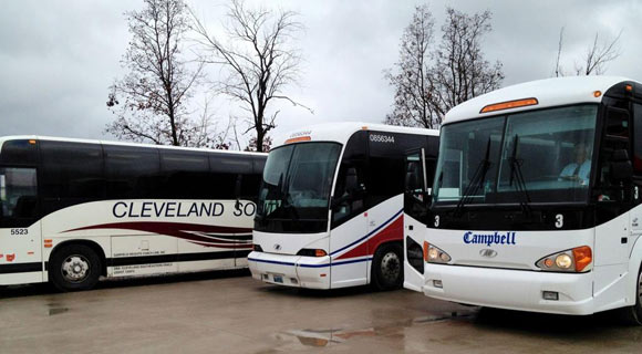 Buses and shuttles in Walnut Creek Amish Flea Market near Walnut Creek and Sugarcreek, Ohio parking lot